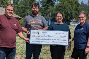 NTCF Board Chair Louise Lodge presents funding to Simpcw First Nation’s Chief George Lampreau, Andre Taniguti, and Rhonda Kershaw for an accounting system upgrade.